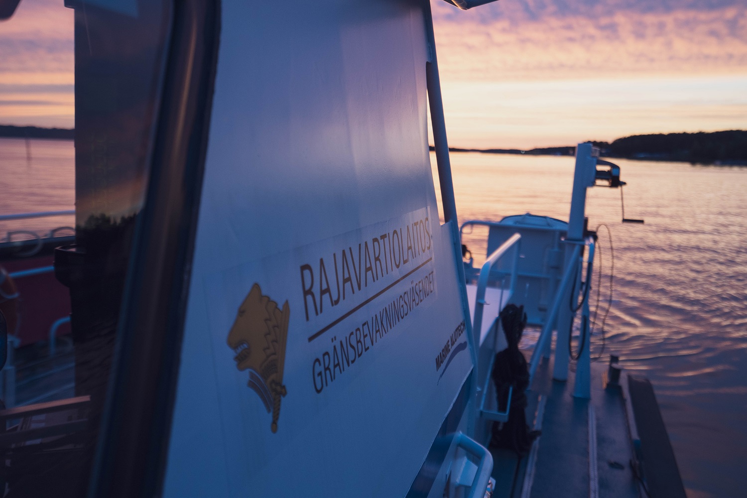 Patrol boat in sunset.