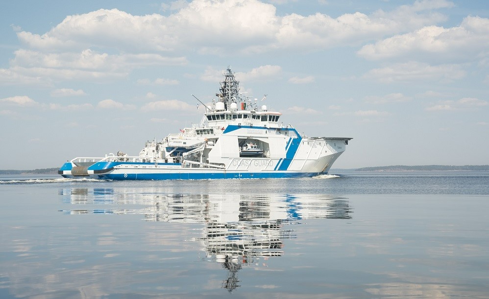A reflection of the patrol boat Turva on the calm surface of the sea.