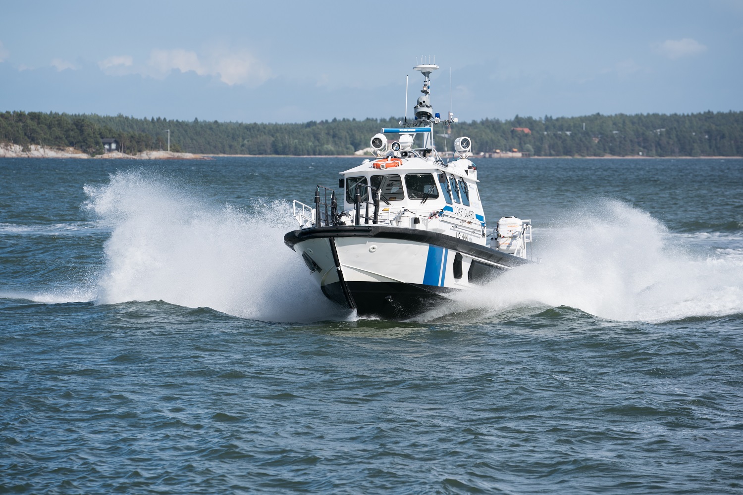 A Coast Guard patrol boat in rough water.